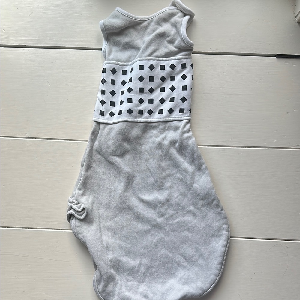 Gray Nanit sleep sack.